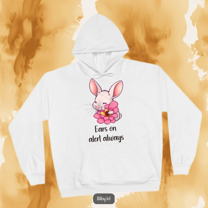 Funny bilby with long ears twitching, excitedly sniffing a large, colorful flower on a cozy hoodie, great for a humorous and warm gift.