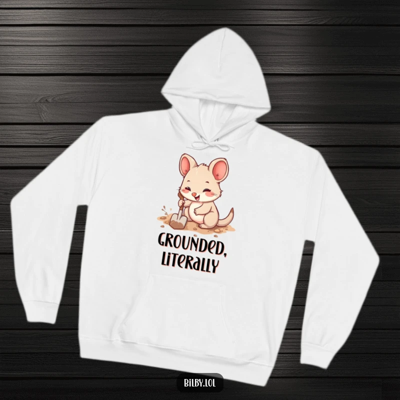 Funny hoodie showcasing a cute, fuzzy marsupial with big ears joyfully digging a burrow with a tiny shovel.